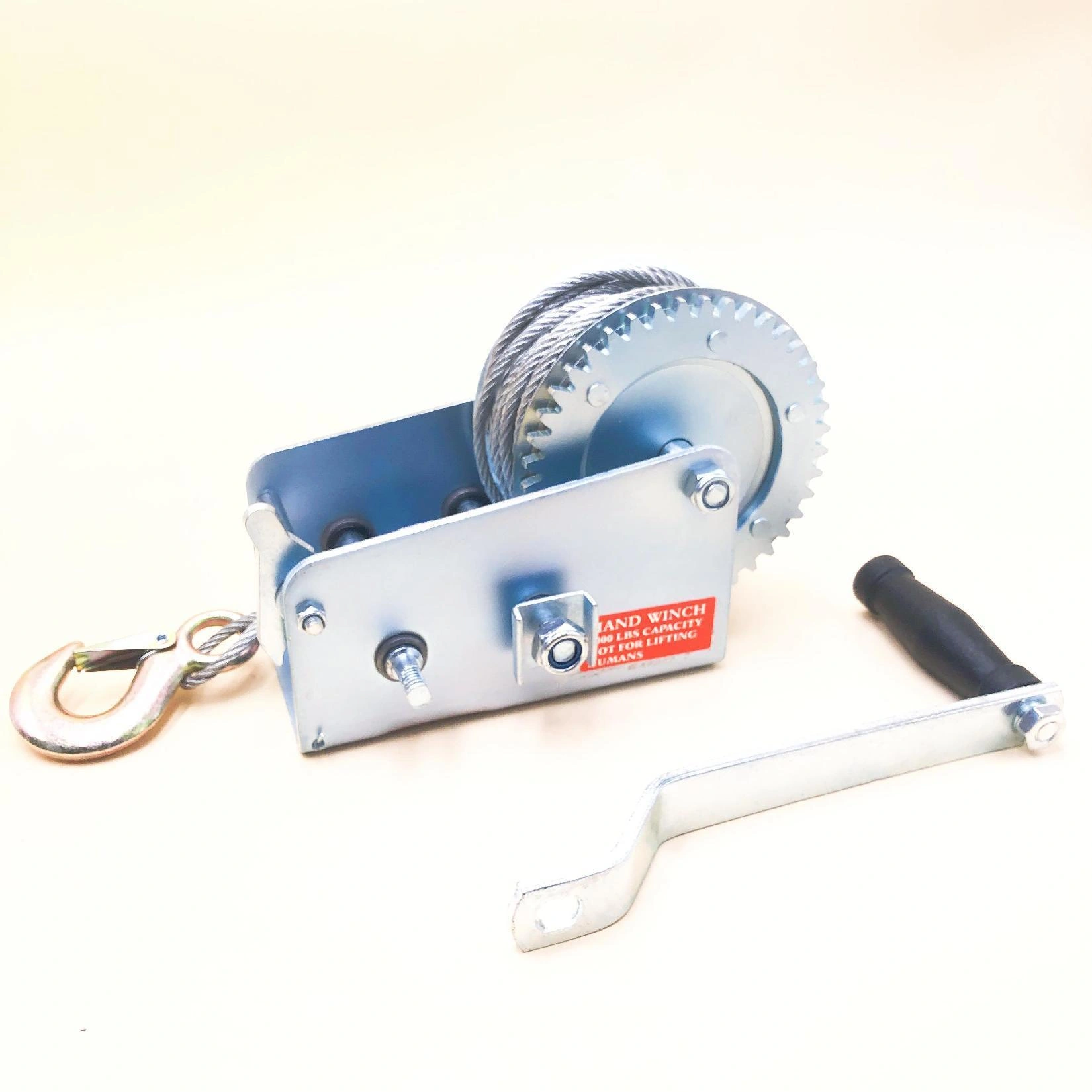 Actual GOODIN GD-C2000 cable winch showing exposed gear, drum, shaft ends and detached crank