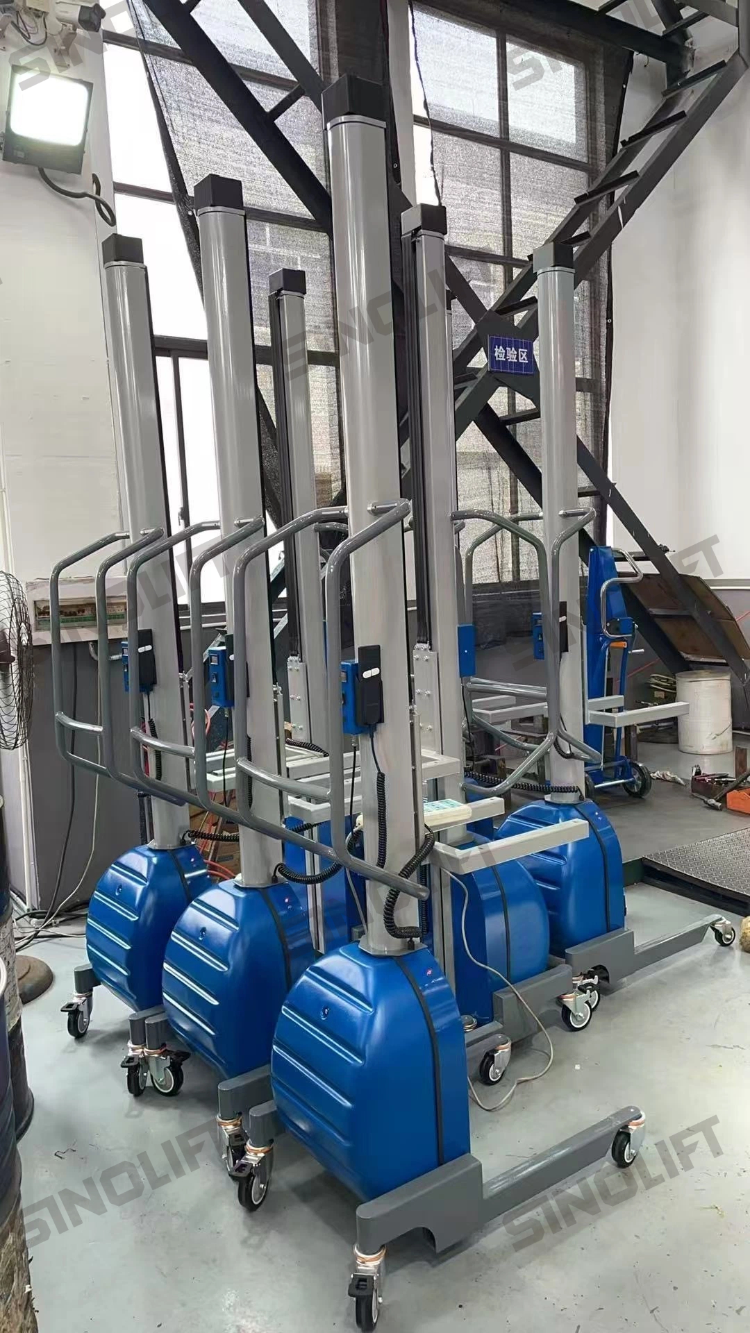 Blue-colored industrial lifting device with ergonomic design for narrow aisle workflows