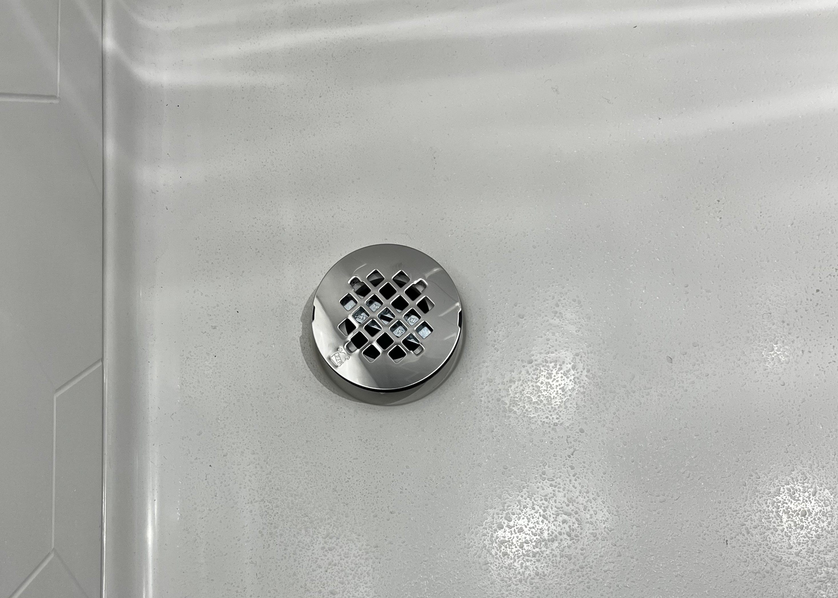 shower pan with corner drain