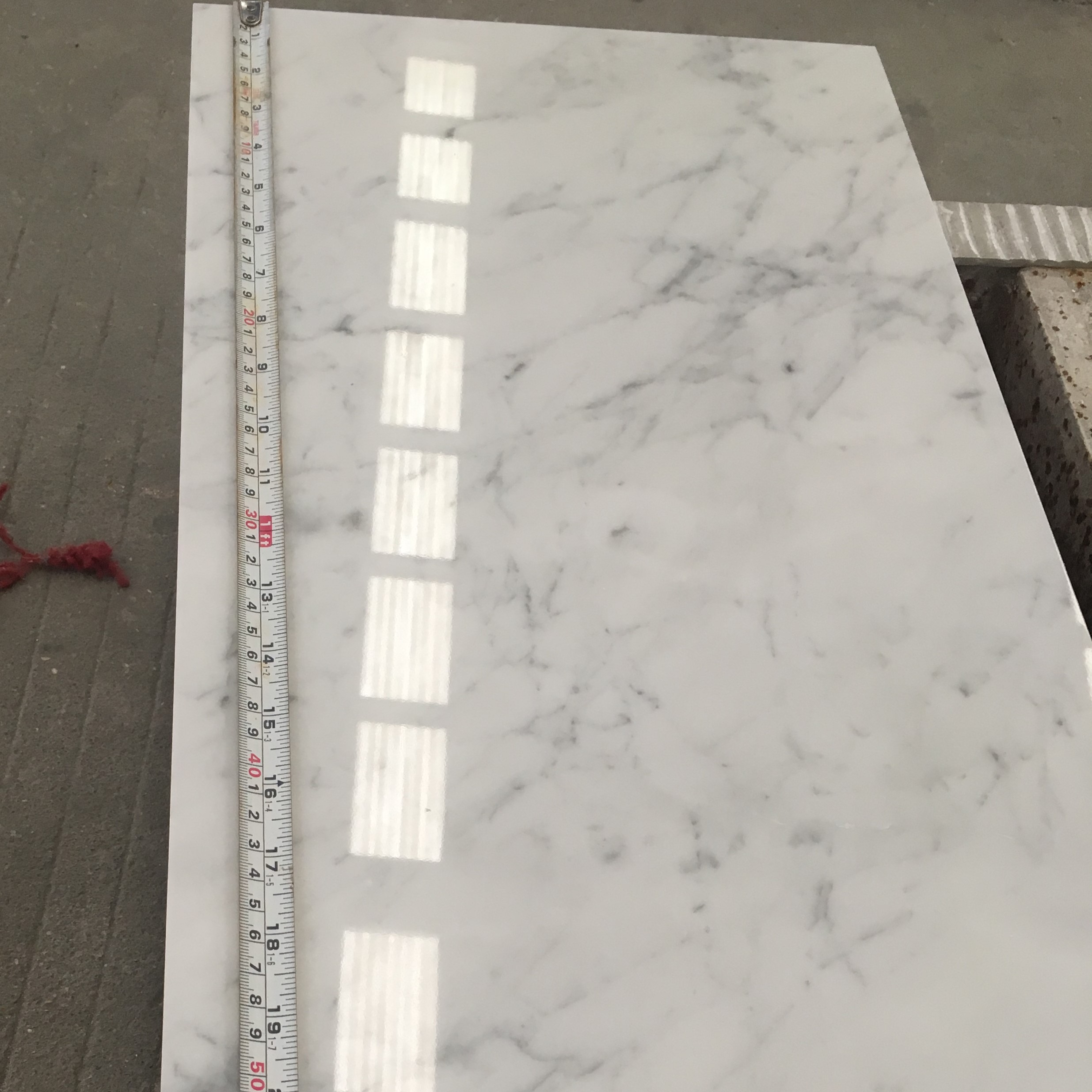 carrara white herringbone marble tile