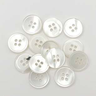 White pearl buttons, reminiscent of classic elegance, exude a timeless charm with their lustrous and iridescent surfaces.