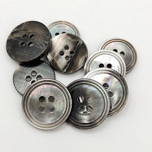 Agoya shell buttons, made from the iridescent mother-of-pearl lining of freshwater mollusk shells, exude elegance and sophistication.