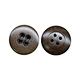 Nut buttons, derived from natural materials such as corozo or tagua palm seeds, are eco-friendly fasteners known for their unique textures and sustainability.