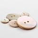 MOP buttons, short for Mother of Pearl buttons, are exquisite fasteners made from the lustrous inner layer of seashells.