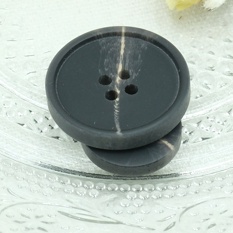 A black button jacket is a versatile and stylish garment that effortlessly combines elegance with functionality.
