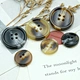 Overcoat buttons are a defining feature of timeless outerwear, blending functionality with elegance
