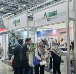 Attendees interacting at the Atena Group booth during an exhibition.