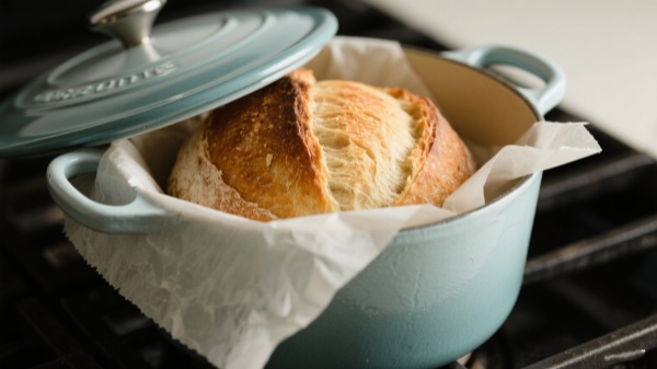 leave at least 1–2 cm of vertical clearance between the top of the proofed loaf and the lid