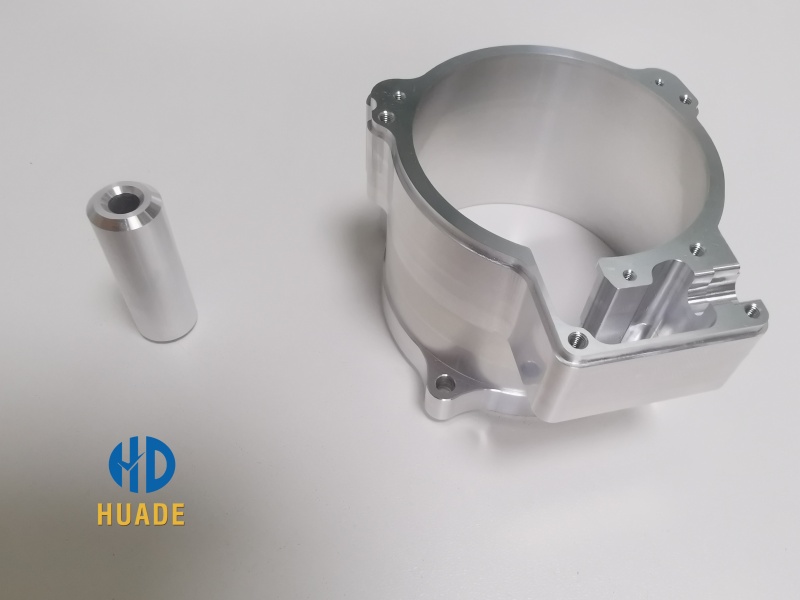 Precision CNC machine automotive parts made from aluminum and stainless steel being crafted by an experienced automotive CNC machining technician in a modern factory near Dongguan