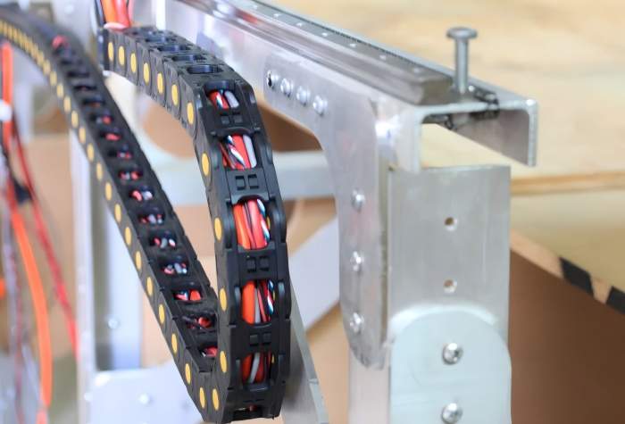 Fully enclosed cable track system offers superior cable protection against dust, debris, and mechanical wear.