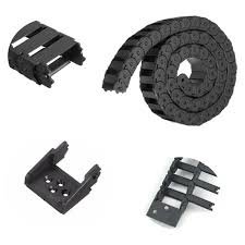 A durable cheap nylon drag chain displayed in an industrial cable management setup.