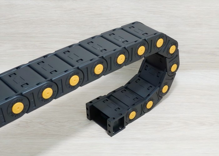 Liquid tight drag chain prevents fluid ingress, ensuring safe cable protection in wet environments.