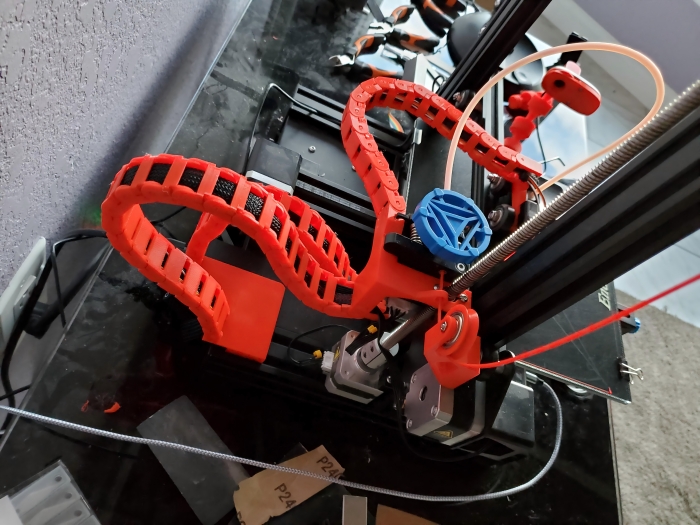 A clean printer gantry cable routing setup guiding wires neatly along the gantry axis.