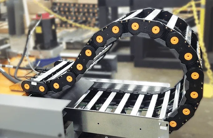 Industrial-strength cable chains securely organizing multiple cords in machinery, with adjustable links and corrosion-resistant coating for long-lasting durability.