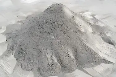Close-up of composite cementitious material matrix showcasing fibers and aggregates
