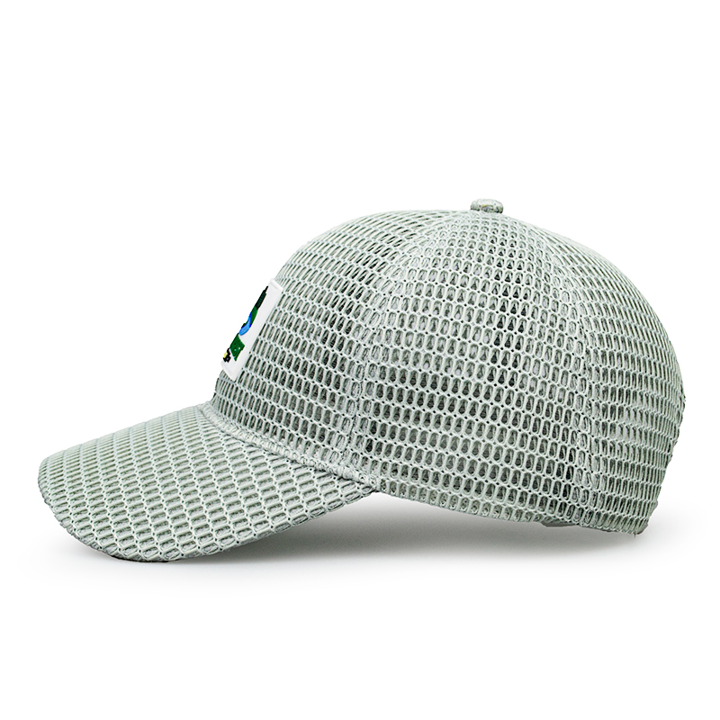 This cap is a stylish and functional accessory perfect for golf enthusiasts. Made with a breathable mesh fabric, it ensures excellent ventilation, keeping your head cool during outdoor activities. The front features a vibrant patch ，howcasing a picturesque golf course scene with a flag, trees, and a winding river, adding a touch of sporty charm. Its lightweight design and comfortable fit make it ideal for a day on the golf .