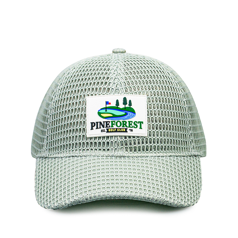 This cap is a stylish and functional accessory perfect for golf enthusiasts. Made with a breathable mesh fabric, it ensures excellent ventilation, keeping your head cool during outdoor activities. The front features a vibrant patch ，howcasing a picturesque golf course scene with a flag, trees, and a winding river, adding a touch of sporty charm. Its lightweight design and comfortable fit make it ideal for a day on the golf .
