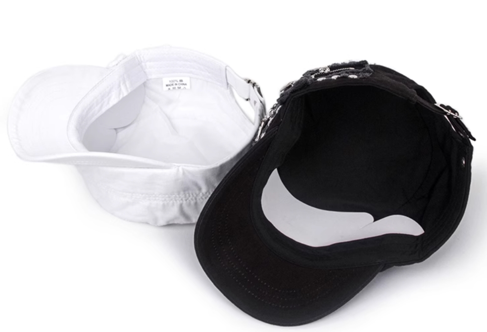 A bold fusion of edgy design and retro charm! These statement-making hats feature a sleek flat crown for a modern silhouette, accented with industrial rivet details and a zipper embellishmet for an urban, avant-garde twist.