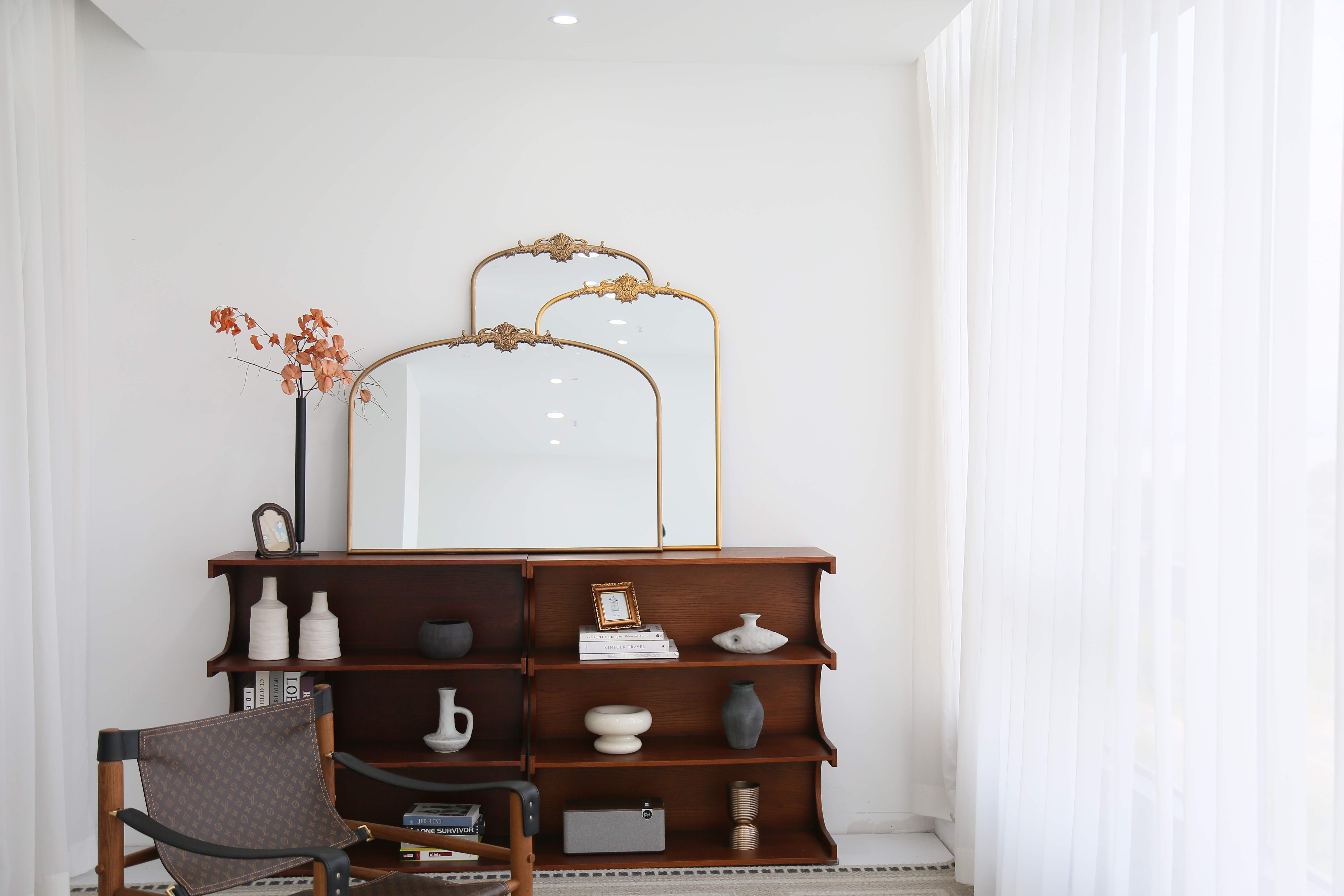 Antique Arch Bathroom Victorian Mirror Collection adding depth to a modern livingroom design