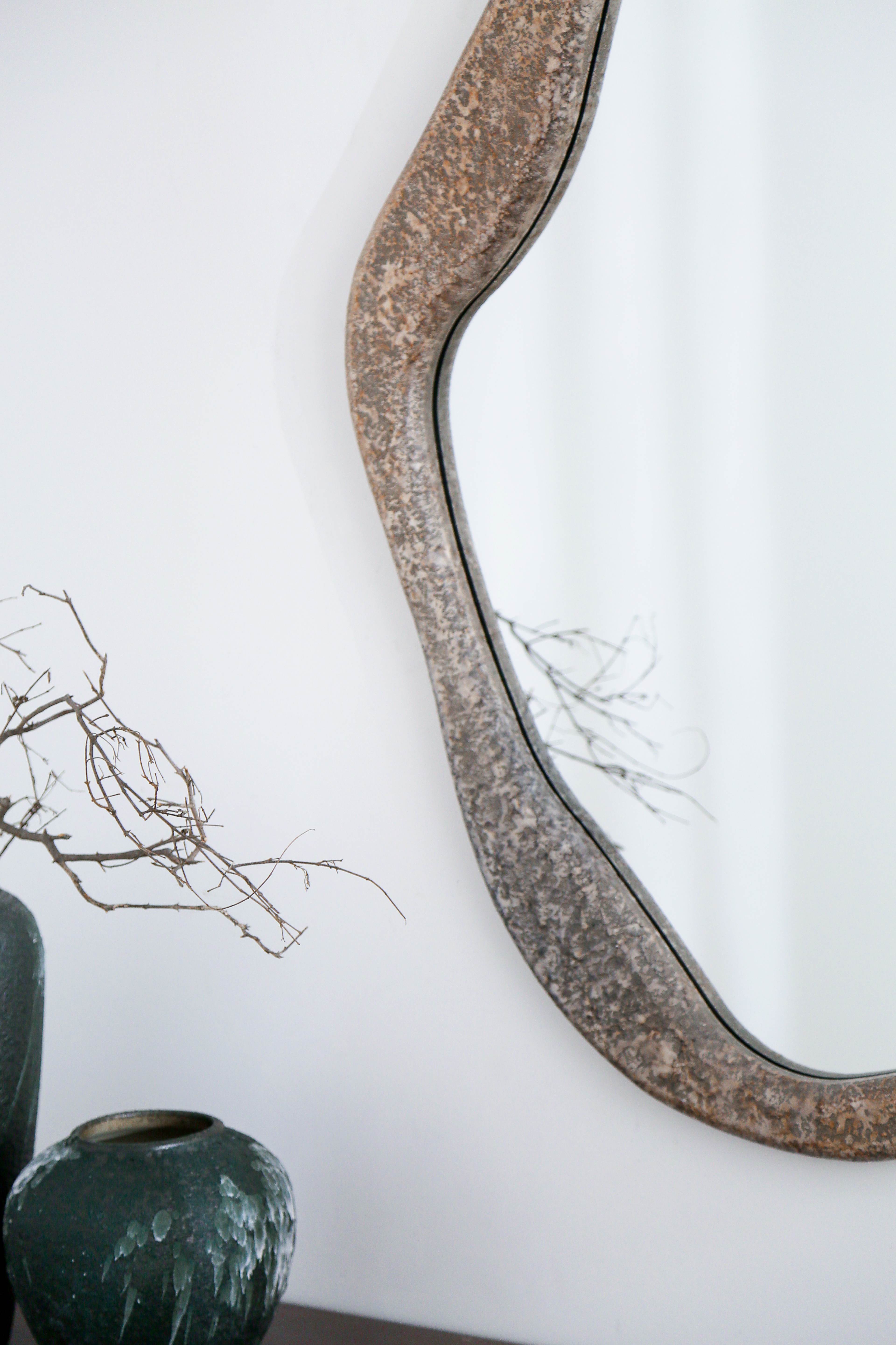 Close up view on irregular mirror on the wall