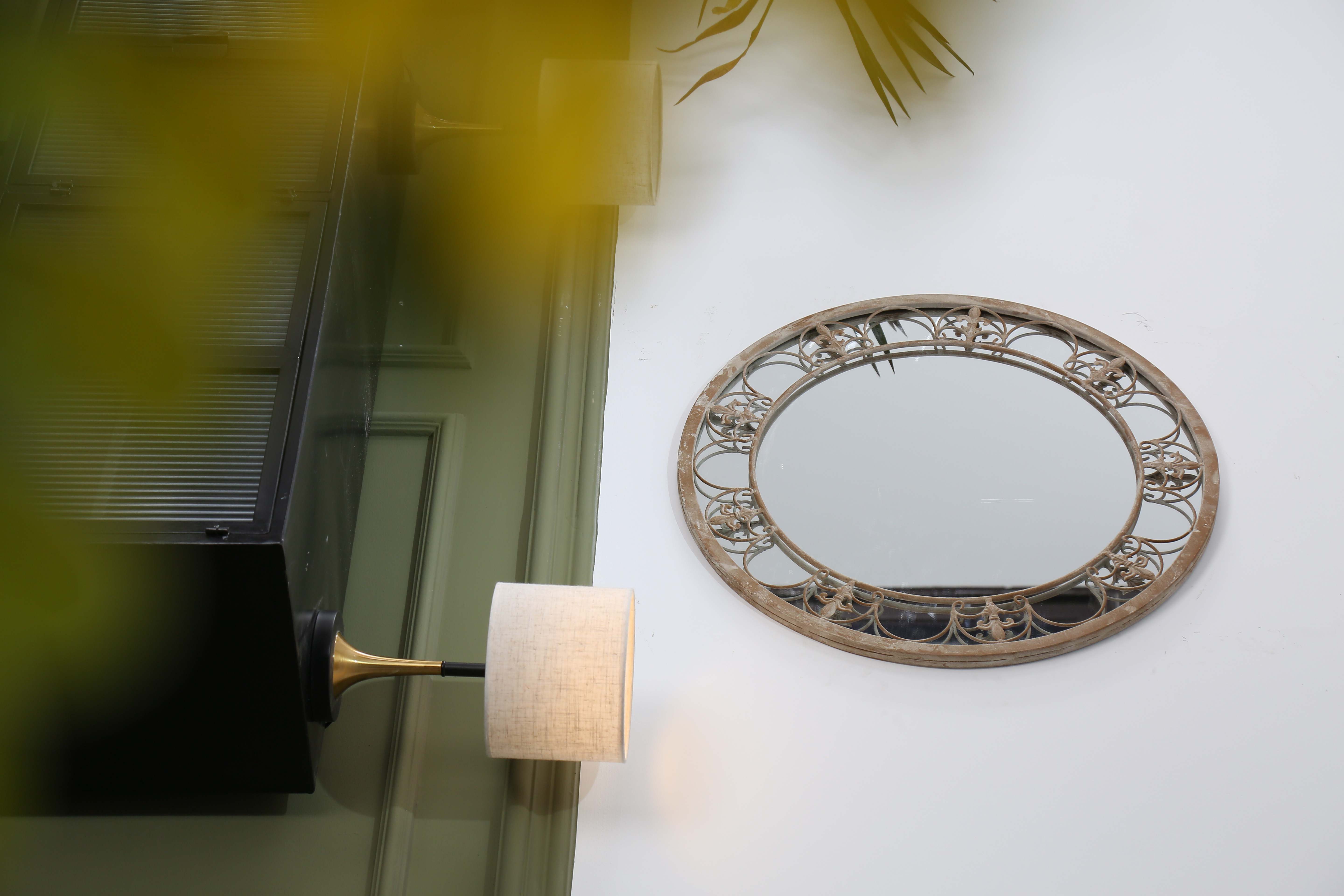outdoor garden mirror on showroom wall