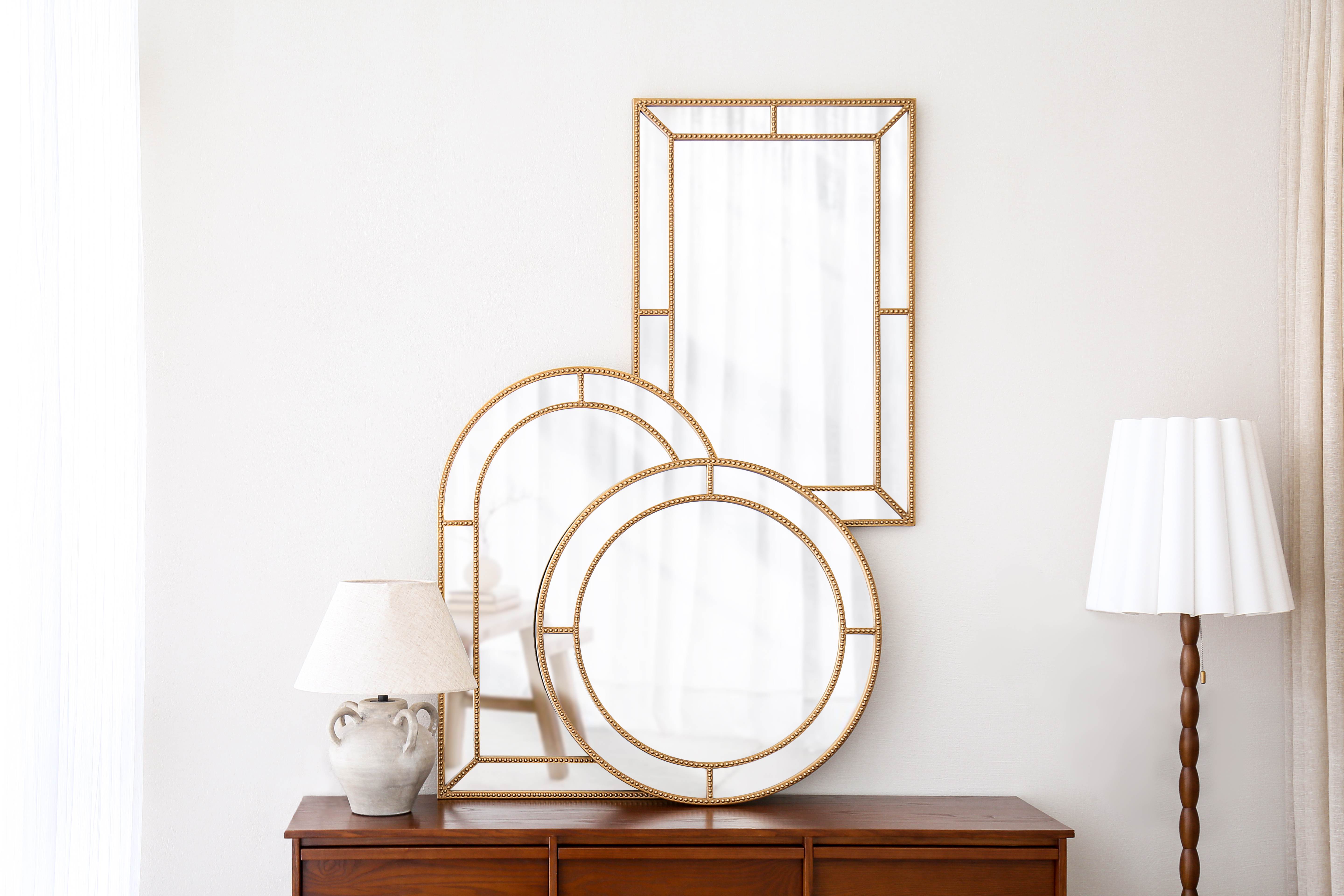 ornate mirror in three types of shape on showroom wall