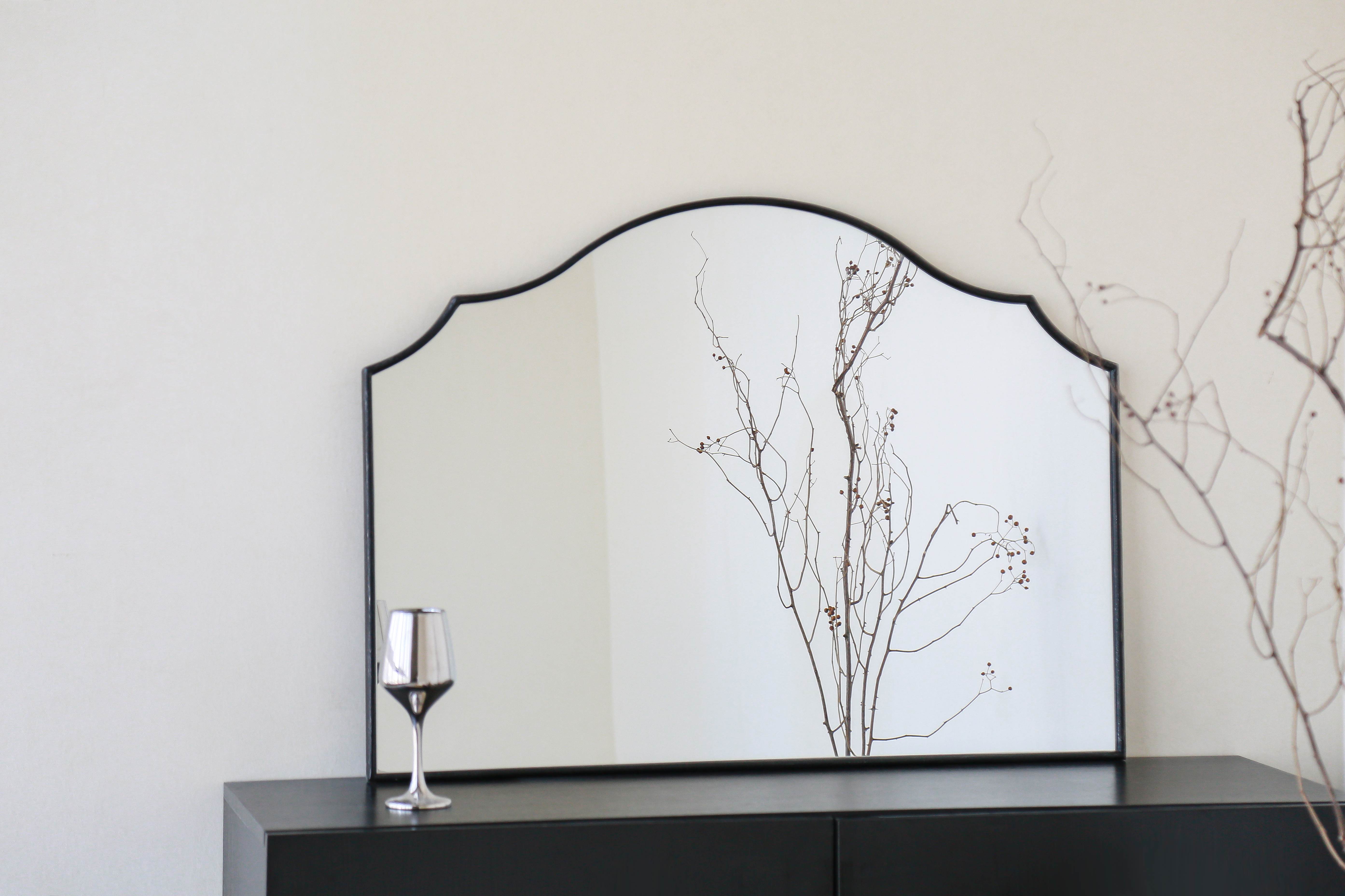 36*26-inch Exquisite Arched Mirror Centerpiece brightening a minimalist entryway