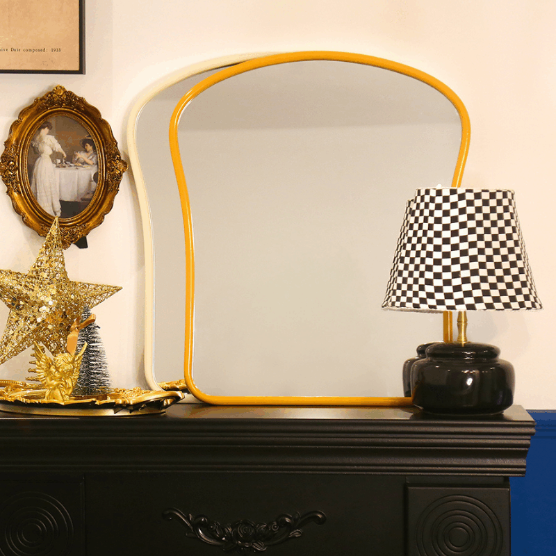 table dresser mirror in two color finishes on a console table