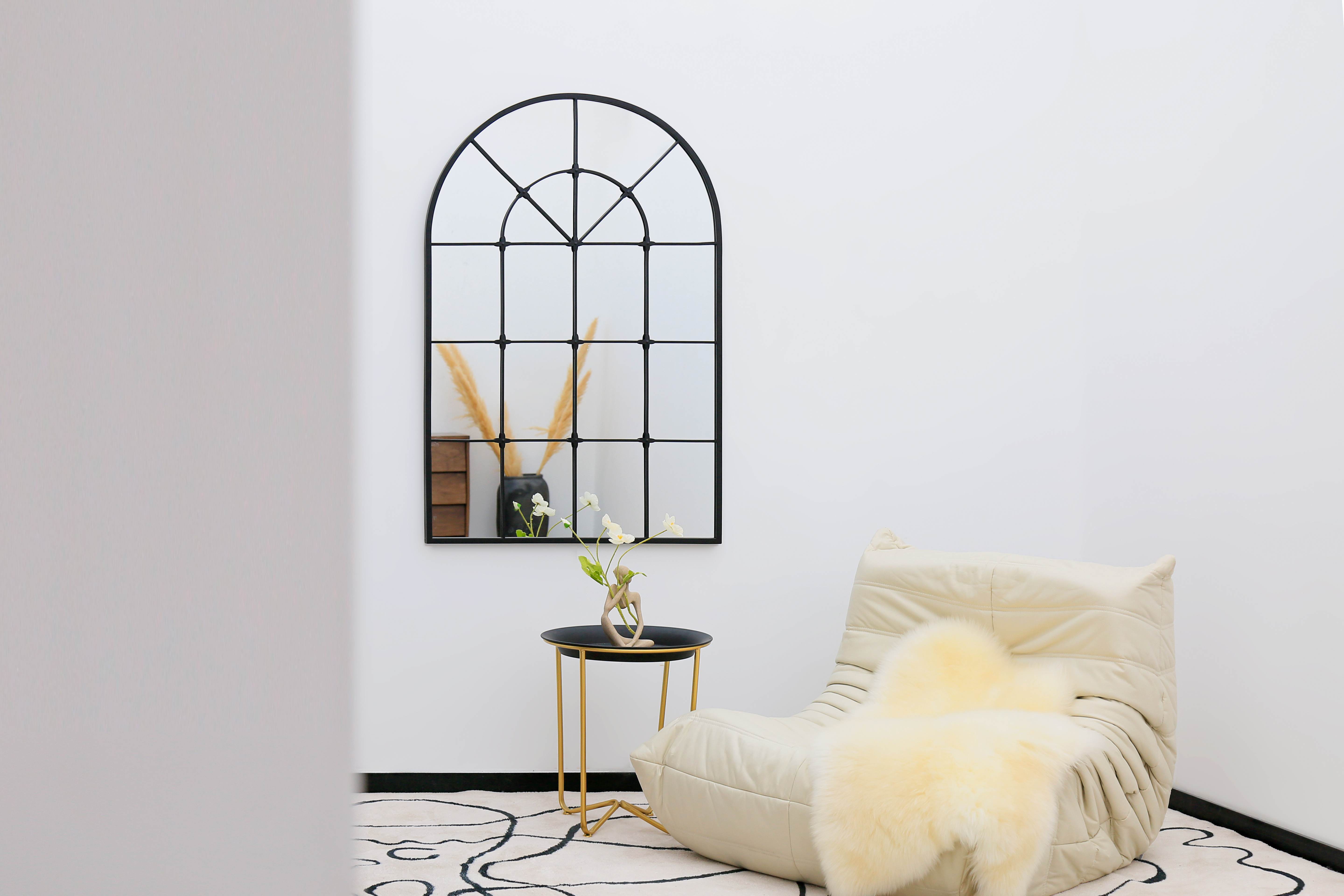 Elegant Victoria Arched Metal Mirror Frame enhancing a cozy living room ambiance