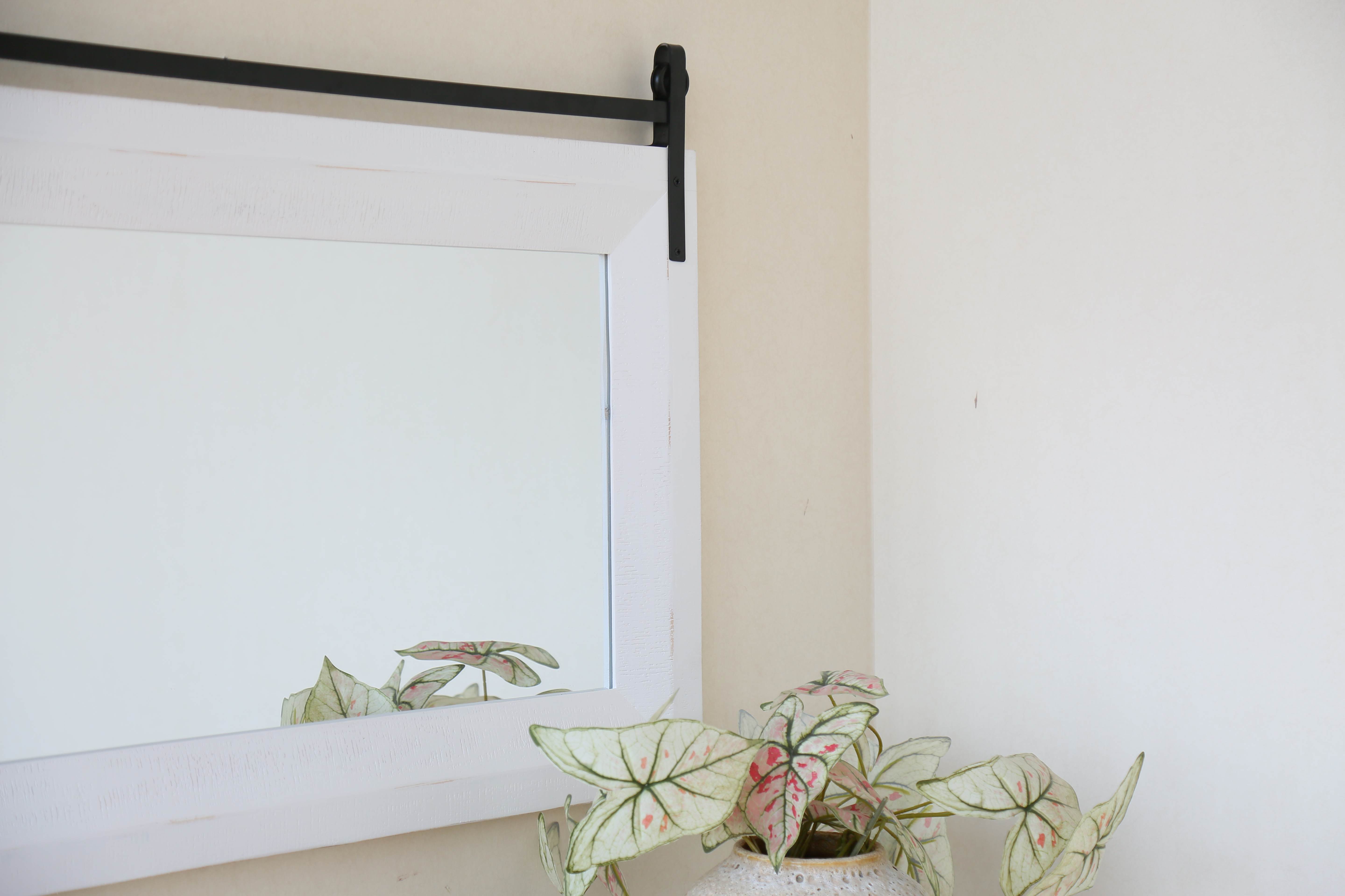 barn door mirror on showroom wall