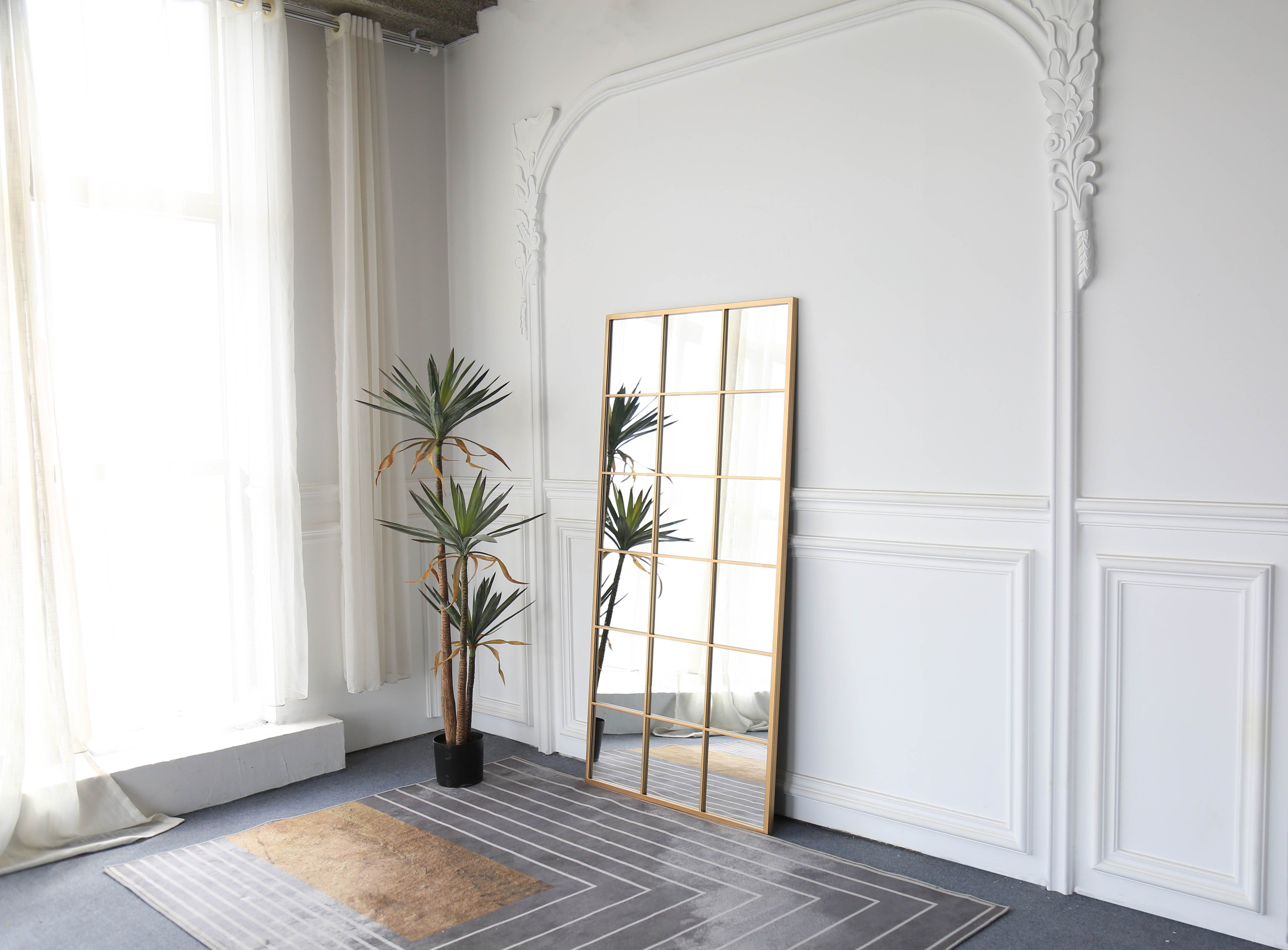 Modern Industrial Grid Huge Standing Mirror showcasing lush greenery in a vibrant home setting
