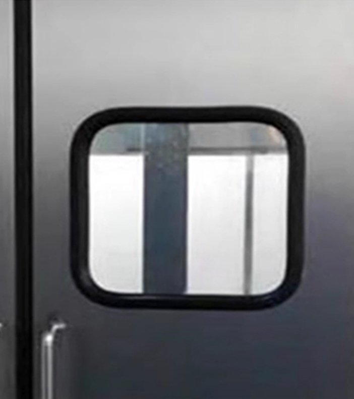 Window of a free-swinging impact door.impact traffic door
