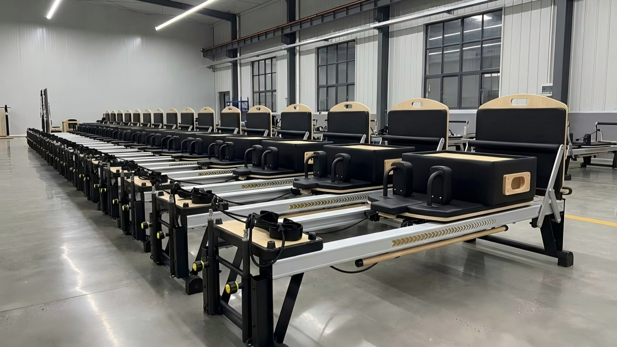MRT V Max pilates reformer with vertical frame aluminum chassis