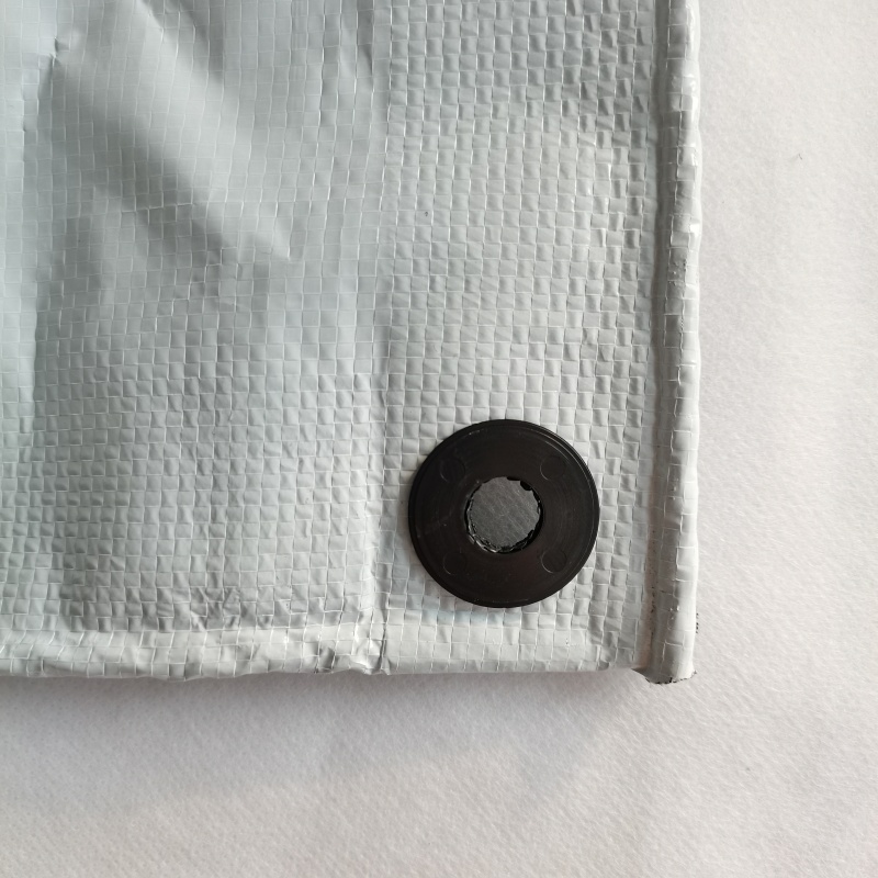 Black & White Poly Film – Plastic Grommet Detail on Cherry Rain Shelter
