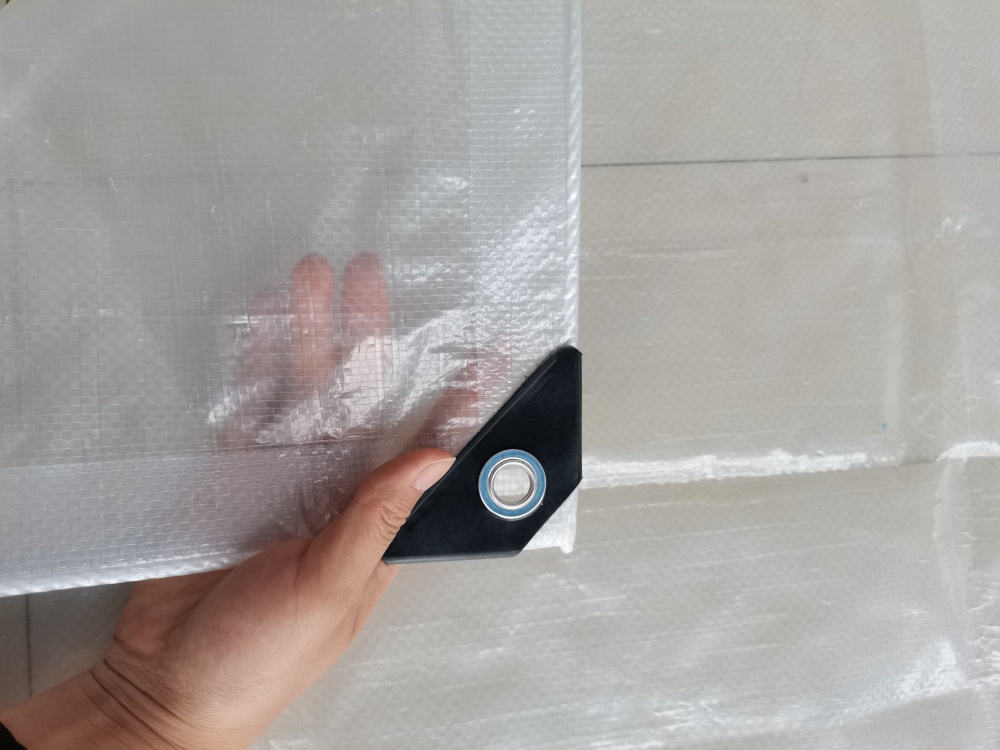 Clear tarpaulin – Corners Reinforced with Triangle Plastic Sheets