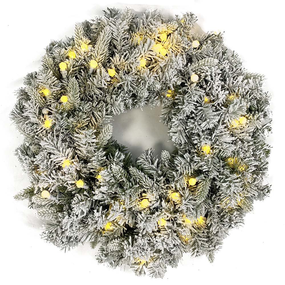 Pre lit flocked Christmas wreath with warm white LED lights and snow covered pine needles. This artificial winter wreath adds cozy festive charm to front doors, mantels, and indoor holiday decorations