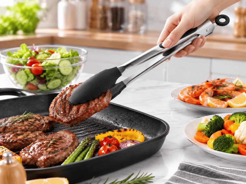 stainless steel kitchen tongs used for cooking and serving food