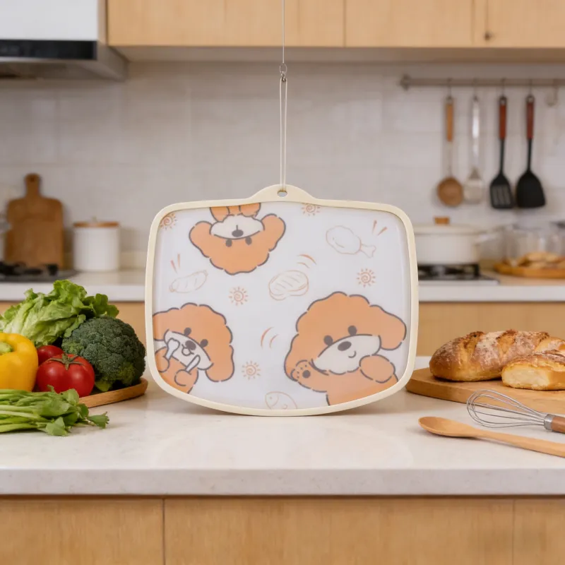 Playful dog-themed kitchen cutting board with a light beige frame, hung on a hook in a modern kitchen, surrounded by fresh vegetables, bread, and utensils, showcasing its convenient storage and cute design.