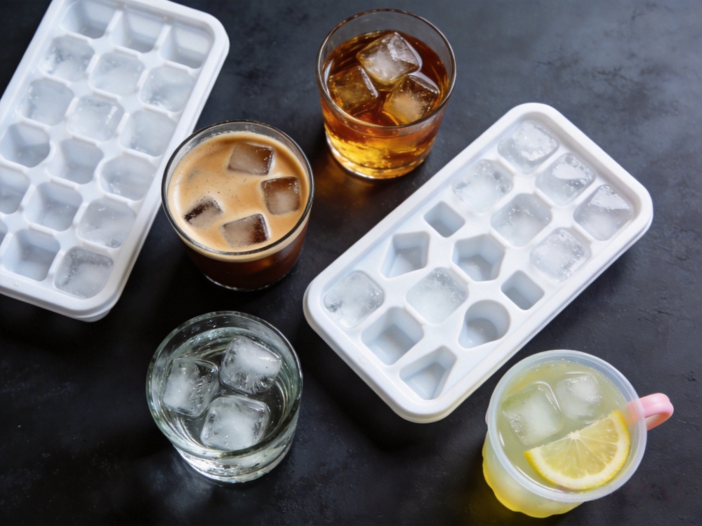 Different ice tray designs used for coffee cocktails whiskey and kids drinks