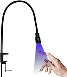 Esta lámpara de escritorio con luz ultravioleta funciona como secador de gel para uñas y lámpara para pestañas, con pedal para uso con manos libres, ideal para salones de belleza o necesidades de manicura en el hogar.