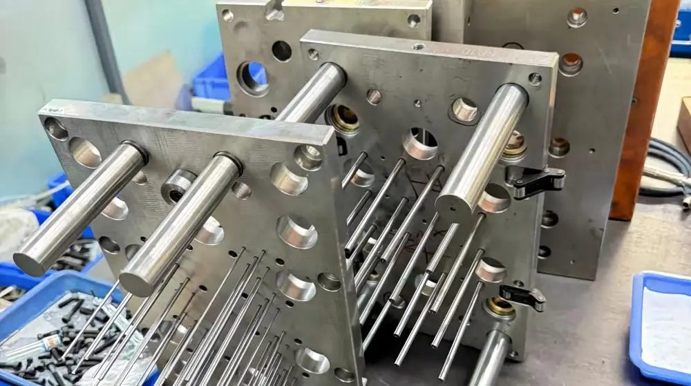 Injection Mold Assembly and Production Progress Injection mold assembly in progress during the manufacturing process