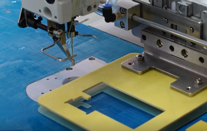 DT 2210G-01A/CH Computerized pattern tacker machine with sliding presser foot
