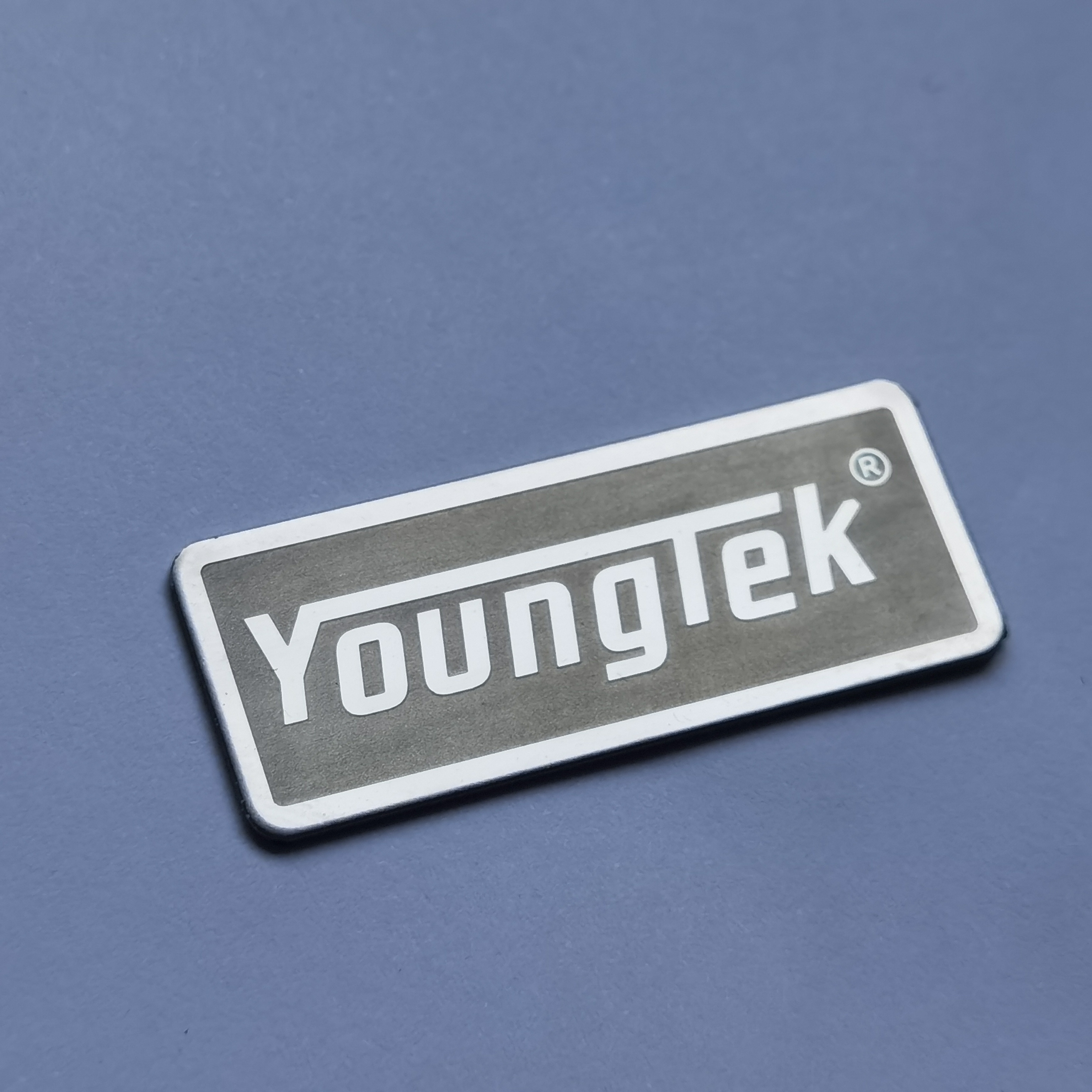 what metal are badges made of