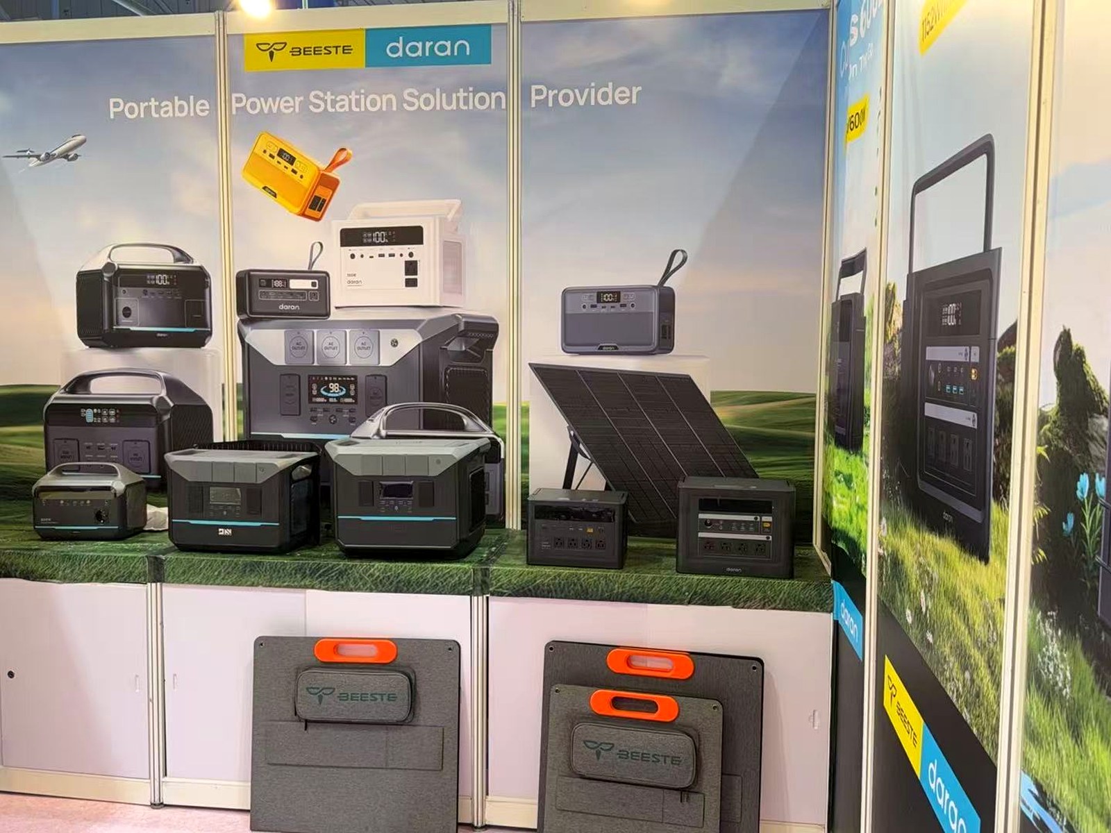 Product display wall with portable power stations and foldable solar panels at booth 9K09