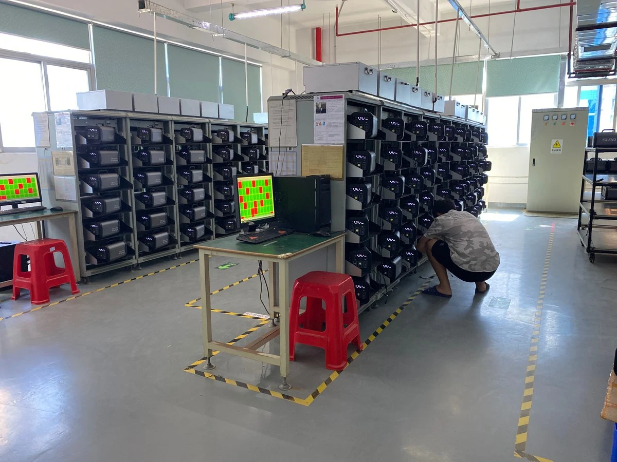 Battery aging racks running charge and discharge cycle tests in the factory