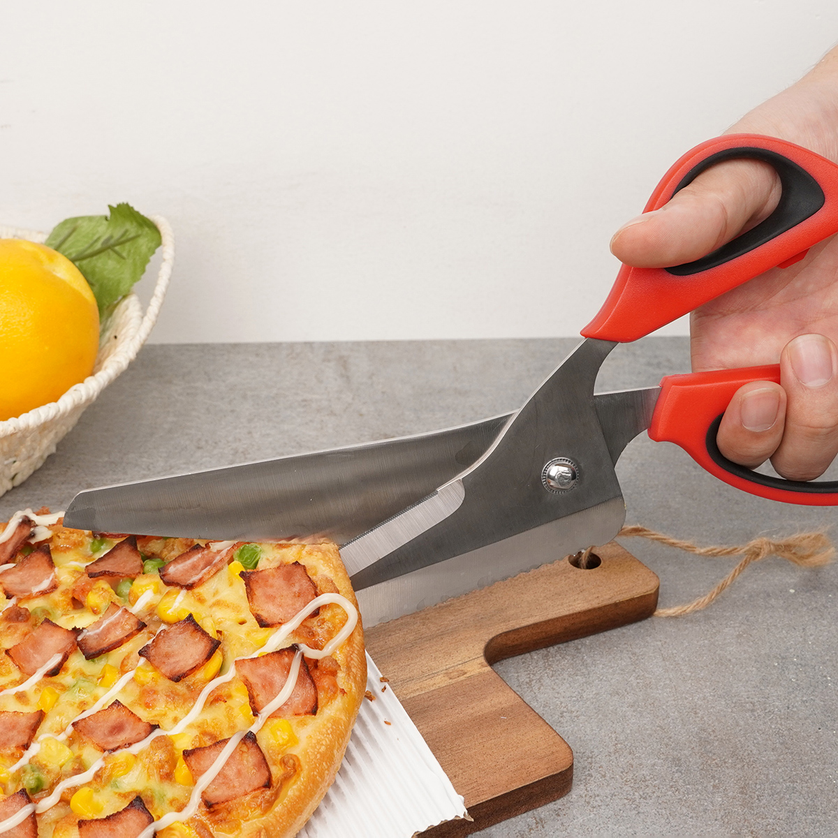 Cutting pizza with scissors