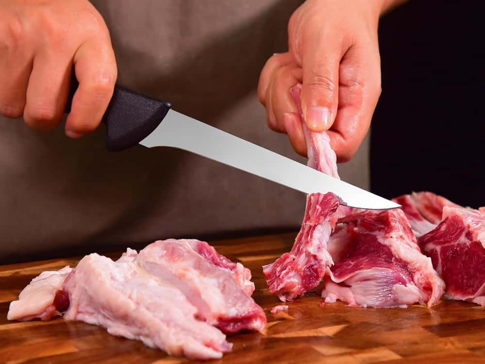 Chef using a boning knife