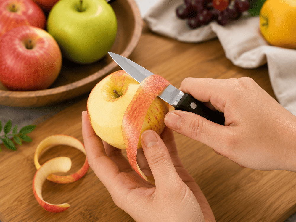 Using a paring knife to peel fruit