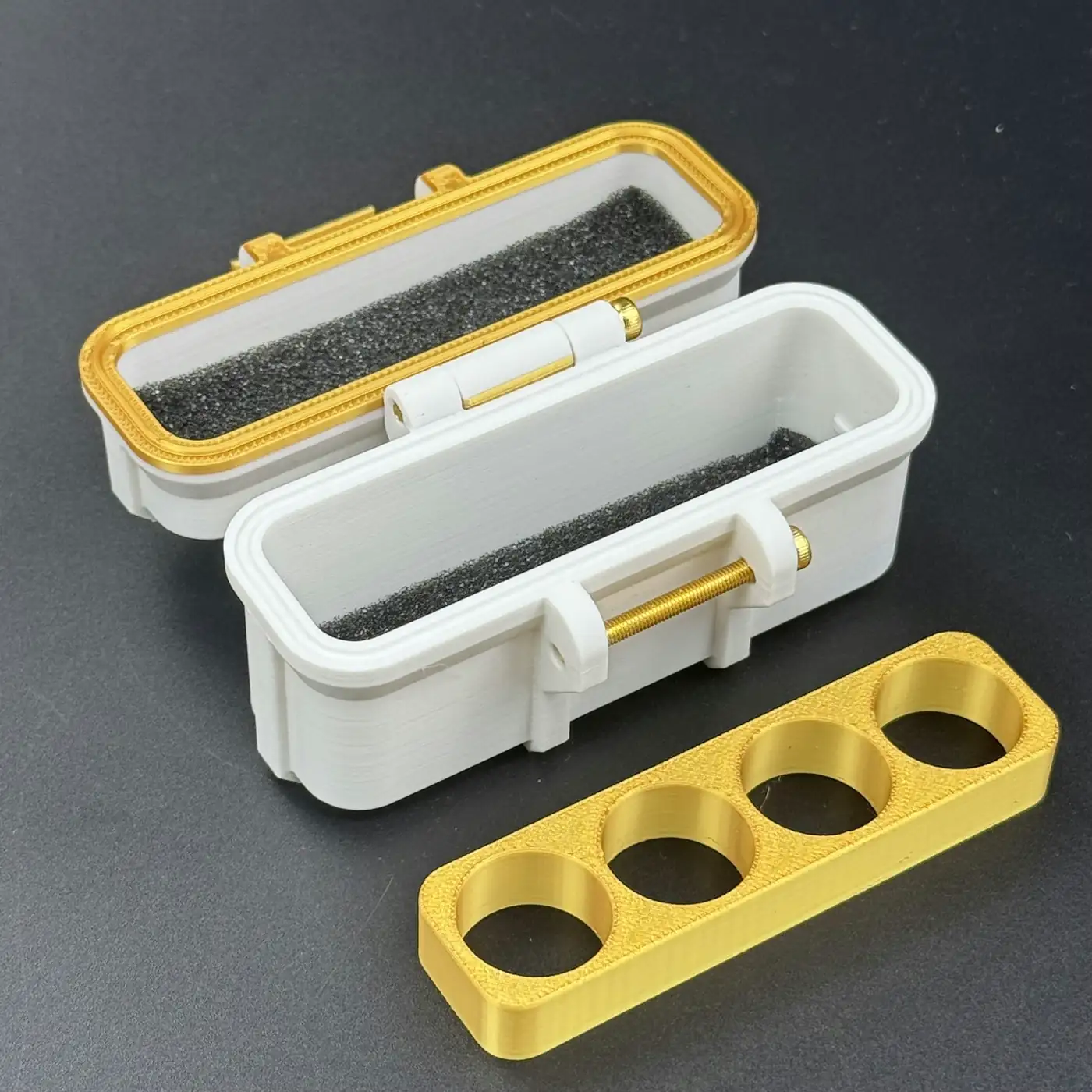 gold insert lifted out of the white 4 slot linear 3ml vial case base