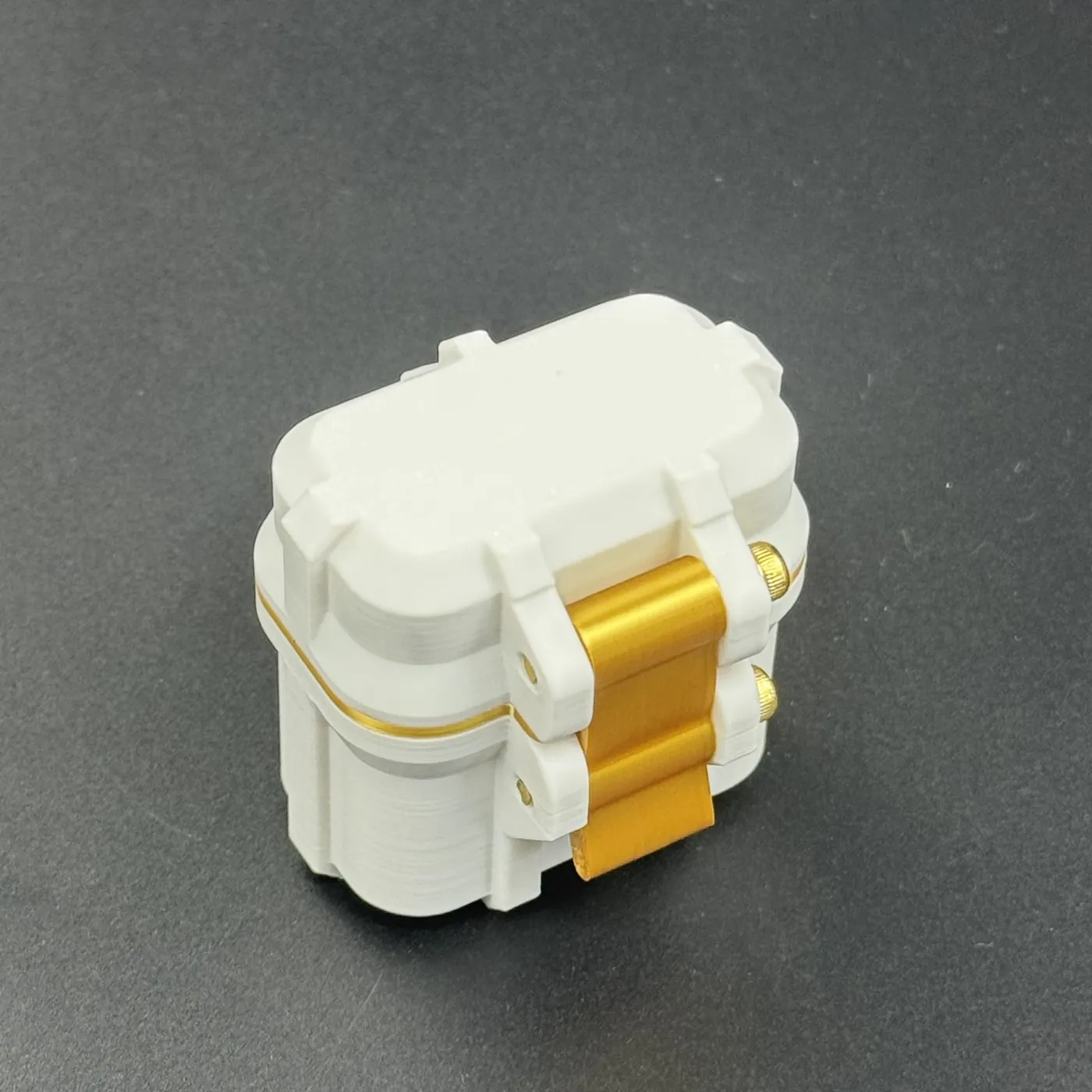 matte white PETG surface of the 3ml vial case with gold latch and lid edge